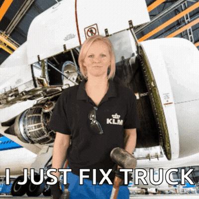 A Woman In A Klm Shirt Holds A Hammer In Front Of A Plane GIF