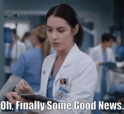 A Woman In A Lab Coat Is Holding A Tablet With The Words Oh Finally Some Good News Written Below Her GIF
