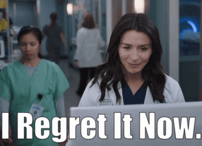 A Woman In A Lab Coat Is Looking At A Laptop With The Words " I Regret It Now " Next To Her GIF