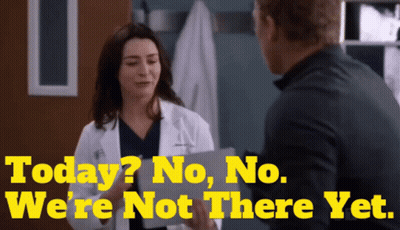 A Woman In A Lab Coat Is Talking To A Man With The Words Today No No We 'Re Not There Yet Behind Her GIF
