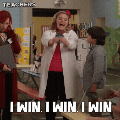 A Woman In A Lab Coat Says " I Win I Win I Win " In A Classroom GIF