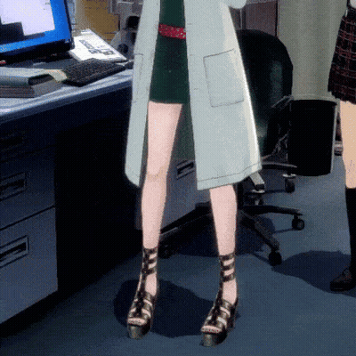 A Woman In A Lab Coat Stands In Front Of A Computer Monitor GIF