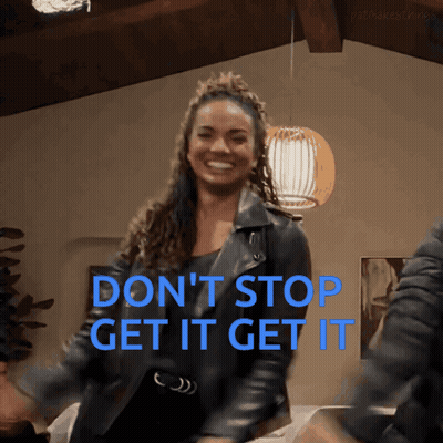 A Woman In A Leather Jacket Is Dancing With The Words " Don 'T Stop Get It Get It " Behind Her GIF