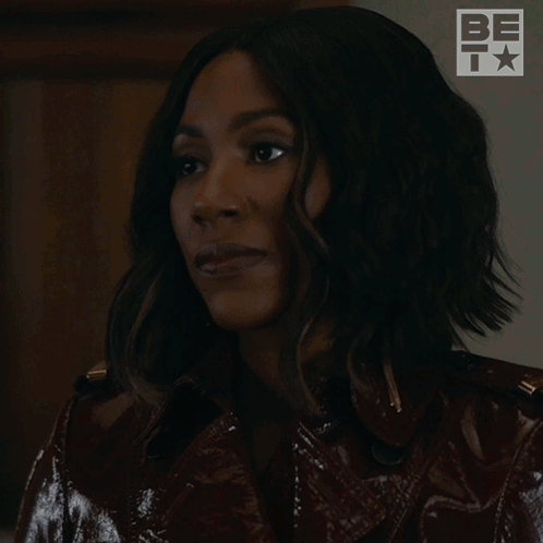 A Woman In A Leather Jacket Is Laughing With The Words Ha Ha Written Below Her GIF