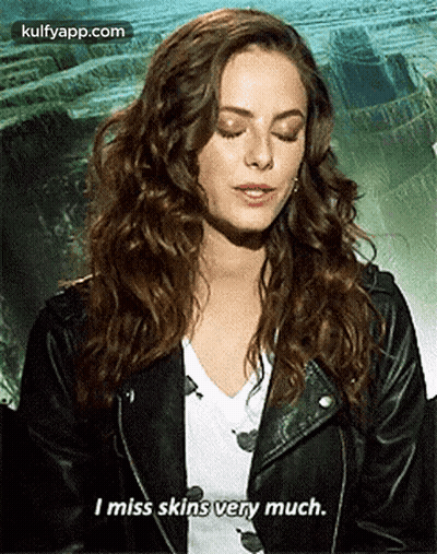 A Woman In A Leather Jacket Is Talking About Missing Skins Very Much . GIF