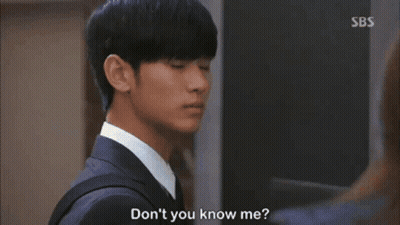 A Woman In A Leather Jacket Is Talking To A Man In A Suit And Says " Don 'T You Know Me " GIF