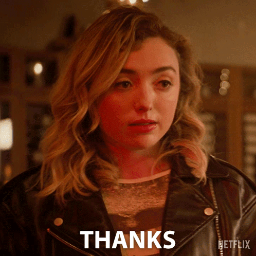 A Woman In A Leather Jacket Says " Thanks " GIF