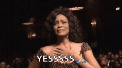 A Woman In A Leopard Print Dress Is Dancing In Front Of A Crowd And Says Yesssss . GIF