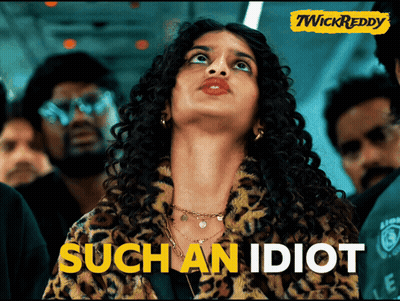 A Woman In A Leopard Print Jacket With The Words Such An Idiot Written On The Bottom GIF