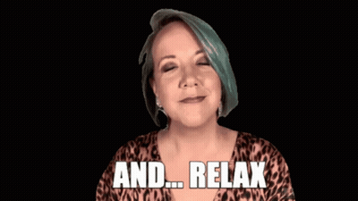 A Woman In A Leopard Print Shirt Is Screaming And Says " And Relax " GIF
