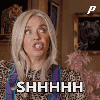 A Woman In A Leopard Print Shirt Says Shhhh In Front Of A Picture Of A Tiger GIF