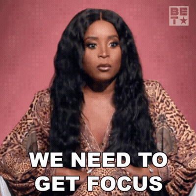 A Woman In A Leopard Print Top Says We Need To Get Focus GIF