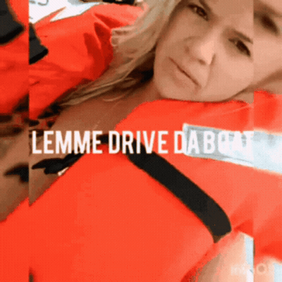 A Woman In A Life Jacket With The Words Lemme Drive Da Boat GIF