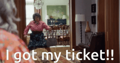 A Woman In A Living Room With The Words I Got My Ticket Below Her GIF