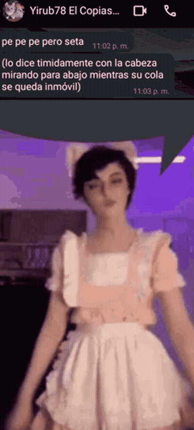 A Woman In A Maid Costume Is Talking On A Cell Phone GIF