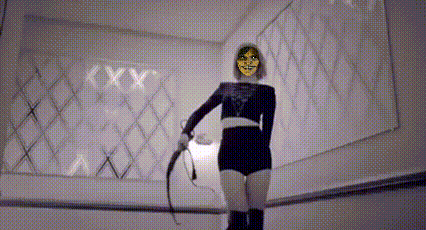 A Woman In A Mask Is Holding A Whip In Front Of A Mirror . GIF