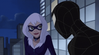 A Woman In A Mask Is Standing Next To A Man In A Suit GIF