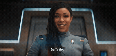 A Woman In A Military Uniform Says Let 'S Fly GIF