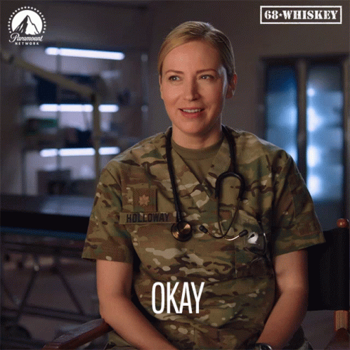 A Woman In A Military Uniform With Holloway Written On Her Uniform GIF