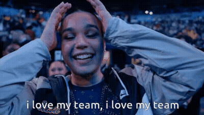 A Woman In A Nike Jacket Holds Her Hands To Her Head And Says I Love My Team GIF