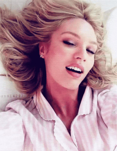 A Woman In A Pink And White Striped Shirt Has The Number Ann14797 On The Bottom GIF