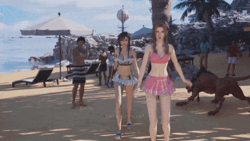 A Woman In A Pink Bikini Stands Next To Another Woman In A Blue Bikini GIF