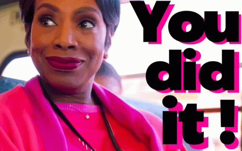 A Woman In A Pink Coat Is Smiling With The Words You Did It Behind Her GIF
