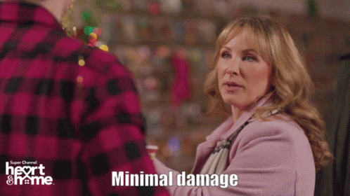 A Woman In A Pink Coat Is Standing Next To A Man In A Plaid Shirt With The Words Minimal Damage Written Below Her GIF
