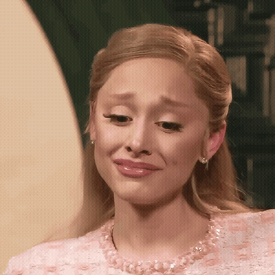 A Woman In A Pink Dress Is Crying GIF