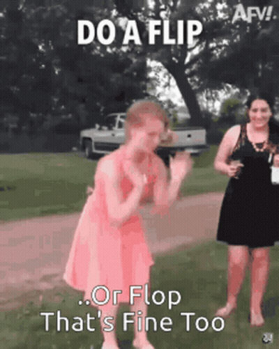 A Woman In A Pink Dress Is Dancing In A Field With A Truck In The Background . GIF