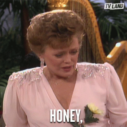A Woman In A Pink Dress Is Holding A Rose And Says Honey GIF