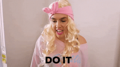 A Woman In A Pink Dress Is Holding A Shrek Toy And The Word Or Else Is On The Bottom GIF