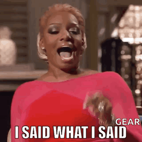 A Woman In A Pink Dress Is Laughing And Saying I Said What I Said . GIF