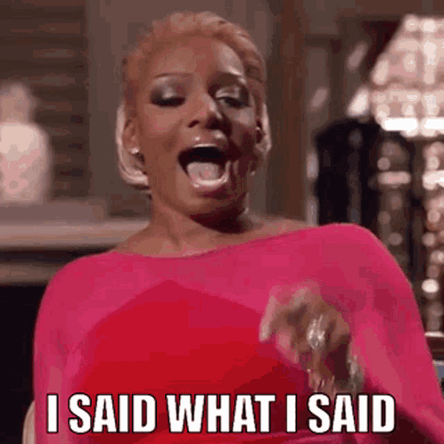 A Woman In A Pink Dress Is Making A Funny Face And Saying `` I Said What I Said '' . GIF