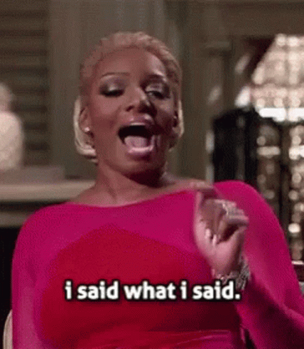 A Woman In A Pink Dress Is Saying I Said What I Said . GIF