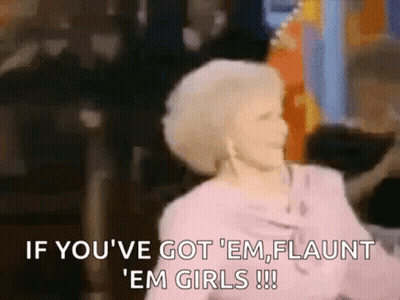 A Woman In A Pink Dress Is Saying `` If You 'Ve Got Em Flaunt ' Em Girls ! '' GIF