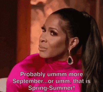 A Woman In A Pink Dress Is Saying `` Probably Ummm More September ... Or Umm , That Is Spring - Summer ! '' GIF