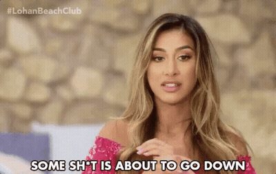 A Woman In A Pink Dress Is Saying Some Shit Is About To Go Down . GIF