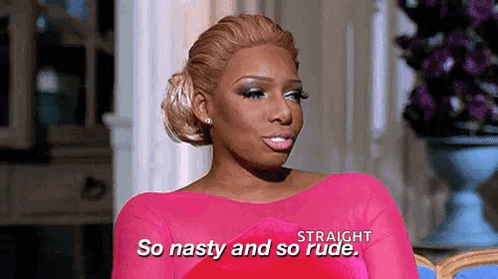 A Woman In A Pink Dress Is Sitting In A Chair And Saying `` So Nasty And So Rude '' . GIF