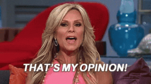 A Woman In A Pink Dress Is Sitting On A Couch And Saying `` That 'S My Opinion '' . GIF