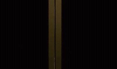 A Woman In A Pink Dress Is Standing In A Dressing Room . GIF
