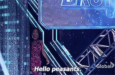 A Woman In A Pink Dress Is Standing In Front Of A Sign That Says Hello Peasants GIF