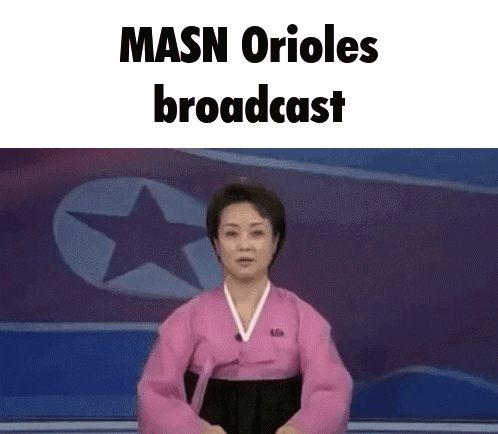 A Woman In A Pink Dress Is Standing In Front Of A Star And The Words Masn Orioles Broadcast GIF