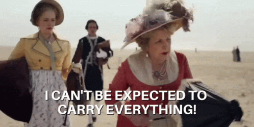 A Woman In A Pink Dress Says I Can 'T Be Expected To Carry Everything ! GIF
