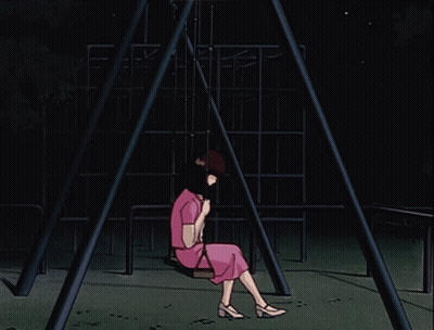 A Woman In A Pink Dress Sits On A Swing In The Dark GIF