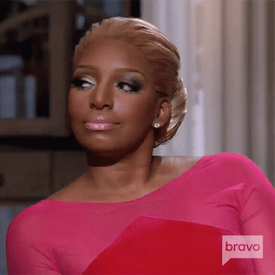 A Woman In A Pink Dress With A Bravo Logo On The Bottom GIF