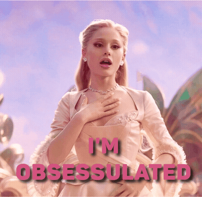 A Woman In A Pink Dress With The Words " I 'M Obsessed " Above Her GIF
