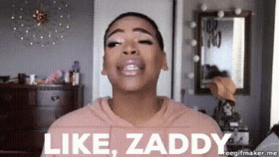 A Woman In A Pink Hoodie Is Making A Face And Saying Like Zaddy . GIF
