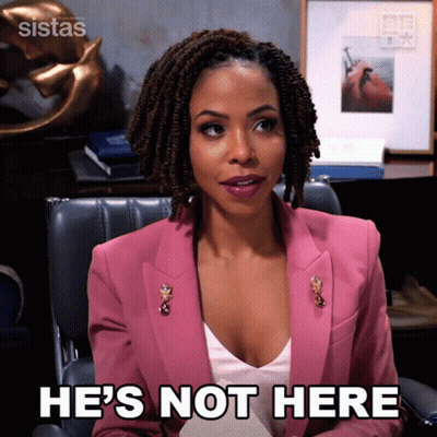 A Woman In A Pink Jacket Is Sitting In A Chair And Saying He 'S Not Here GIF
