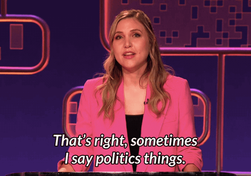 A Woman In A Pink Jacket Is Talking About Politics GIF